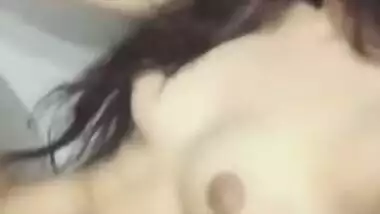 Risque Indian babe takes breasts and pussy out in a short porn video