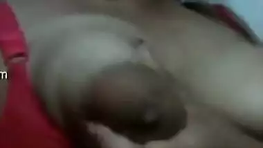 Eye-catching Indian girl has fun playing with sexy huge nipples