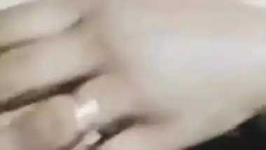 Desi woman in floral robe teases lover demonstrating big breasts